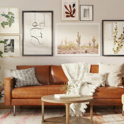 Spacious Living Rooms With Plenty Of Room To Host living room with a couch coffee table and art on the wall