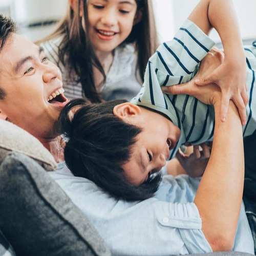 A perfect fit for the whole family a family playing on the couch