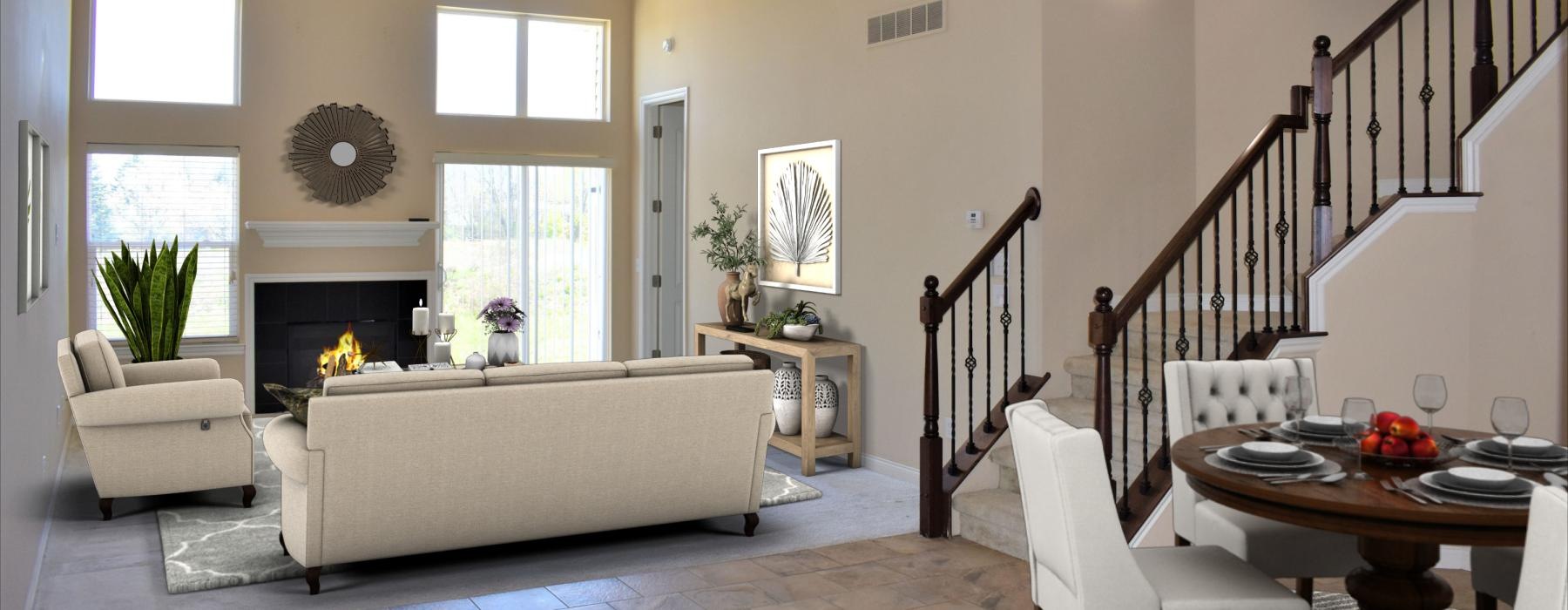 a living room with a couch and a dining room table